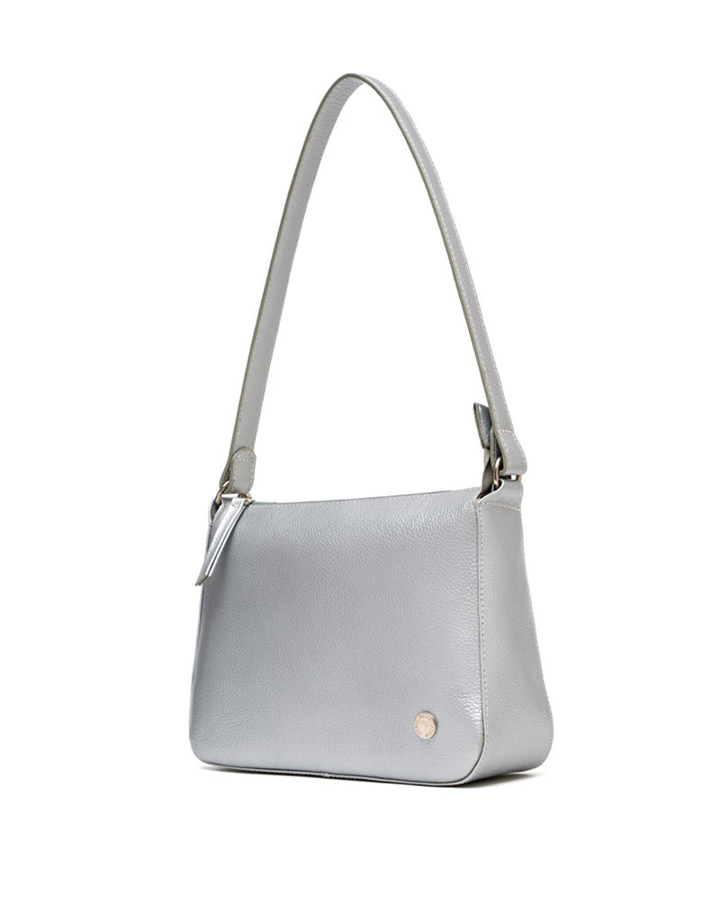 Bolso manos libres en cuero para dama color plateado